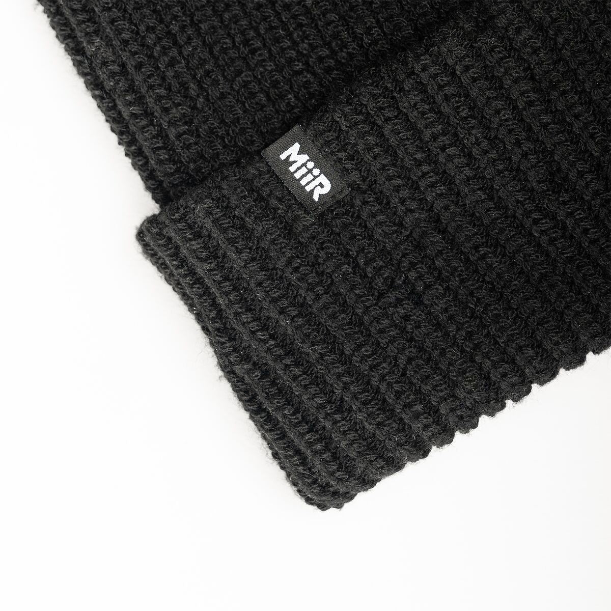 recycled-poly-rib-beanie-w0 WebPDP-RecycledPolyRibBeanie_Studio_TagDetail_Black__BNE002002OS.jpg